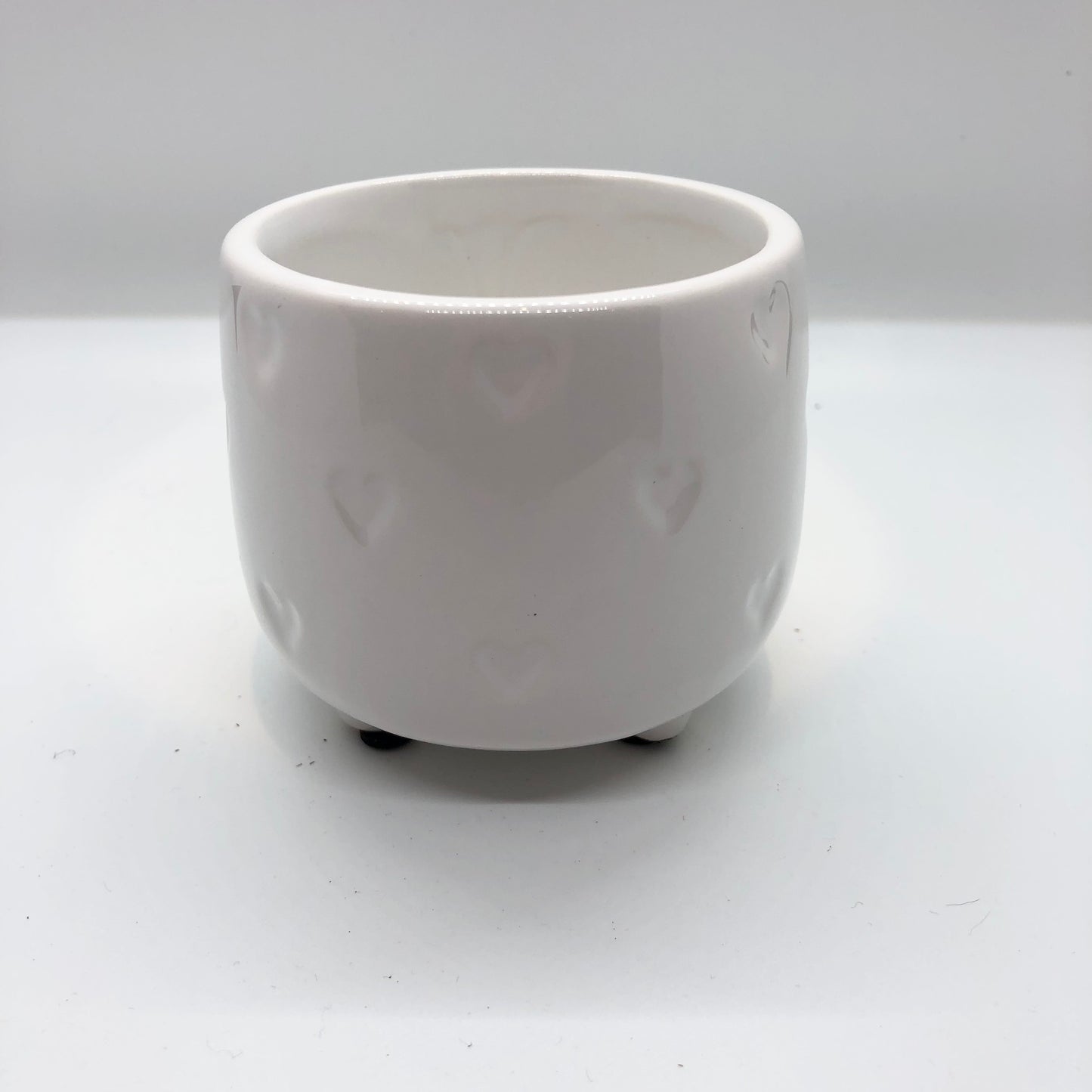 
                  
                    Footed White Dolomite Pot with Hearts
                  
                